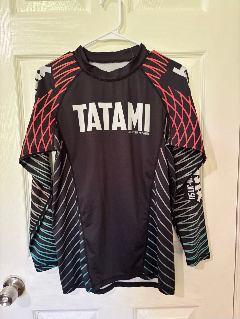 Tatami Men’s Black Rash Guard Swim Top with Red and Teal Accents